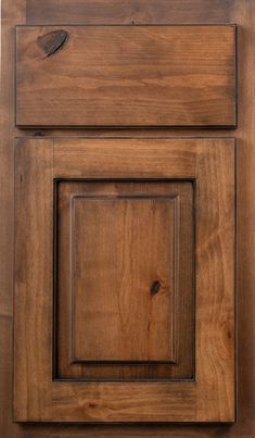 a close up of a wooden cabinet door