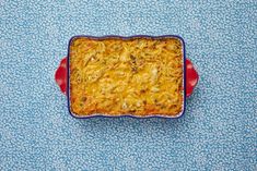 a casserole dish on a blue tablecloth