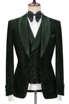 a green jacket and bow tie on a mannequin