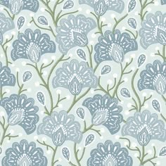 a blue and white flower pattern on a light green background with small dots in the center