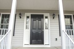 a black and white front door on a house