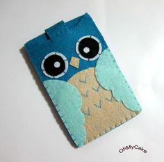 an adorable little blue owl with big eyes on it's back cover for a cell phone