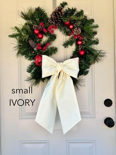 a white door with a christmas wreath on it