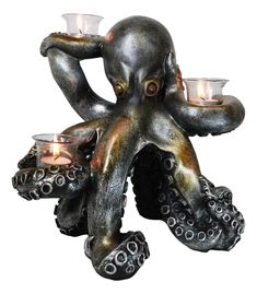 an octopus table lamp with two candles on it