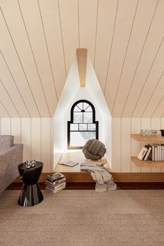 a room with a window, bookshelf and a chair in the corner on the floor