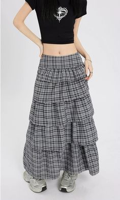 Channel understated chic with this Layered Plaid Maxi Skirt featuring delicate ruffle details.
Crafted from a comfortable blend of mainly cotton, this skirt showcases a multi-layered design that adds a playful twist to the classic plaid pattern. The high-waist cut ensures a flattering silhouette, while the versatile style makes it easy to dress up or down. It's a piece that carries a perfect balance of edgy and professional aesthetics.
Pair this skirt with a tucked-in graphic tee and sneakers fo Chic Tiered Maxi Skirt With Layered Hem, Chic Relaxed Tiered Skirt, Layered Long Skirt For Spring, Relaxed Long Skirt With Layered Hem, Casual Tiered Maxi Skirt With Gathered Detail, Chic Tiered Maxi Skirt With Ruffle Hem, Chic Tiered Lined Skirt, Tiered Bottoms With Layered Hem, Chic Tiered Skirt With Layered Hem