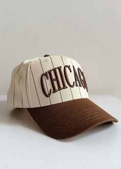 **Exclusive A&W Original Design**Our iconic Chicago Puff Cap with an old school sporty twist. This exclusive embroidered Chicago Puff Cap features an ivory and espresso pinstriped base with an espresso brim.Alice & Wonder '&' logo embroidered at back left.Plastic adjustable snap closure. One size fits most. Cute Baseball Hats, Accessories Branding, Logo Embroidered, Snap Closure, Baseball Cap, Original Design, Old School, Espresso, Baseball Hats