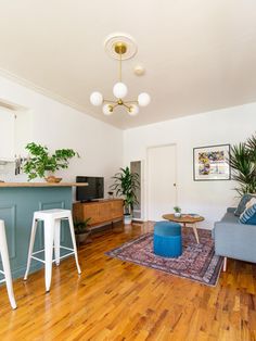 a living room filled with furniture and wooden floors