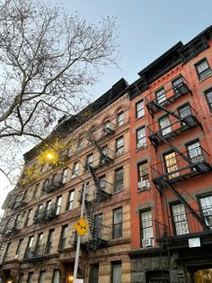 an apartment building with fire escapes and stairs