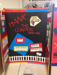 a sign that says thank to the cowdog in front of a bulletin board with information on it