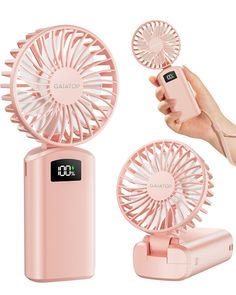 a pink portable fan is being held up by a person's hand and the other side has an alarm clock on it