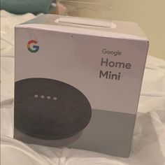 the google home mini is in its box and ready to be used as an alarm clock