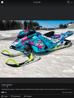 a snowmobile is parked in the snow