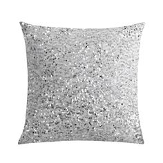 a silver sequin pillow on a white background