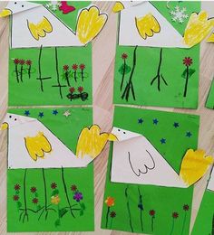 some paper pictures with yellow birds on them