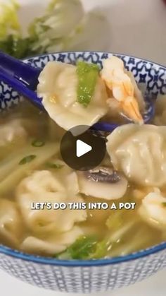 a bowl filled with noodles and broccoli on top of a table