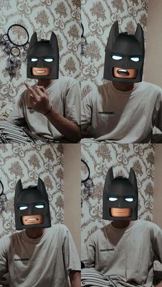 a man wearing a batman mask sitting on top of a bed