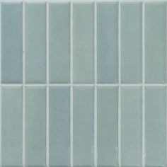 a white and blue tiled wall with vertical lines