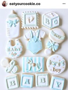 baby shower cookies are arranged on a table