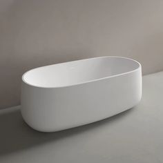 a white bath tub sitting on top of a counter