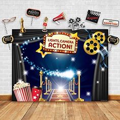 an image of a stage set up for a movie event with popcorn, film reels and other decorations