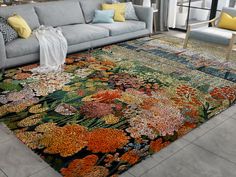 a living room filled with lots of furniture and rugs on top of a floor