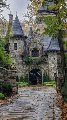 the entrance to an old castle in autumn