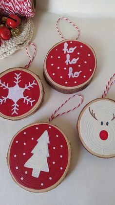 three wooden slices with christmas decorations on them