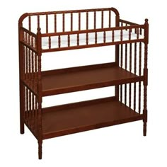 a wooden crib with two shelves on each side