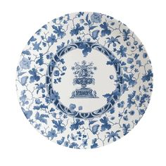 a blue and white plate with flowers on it