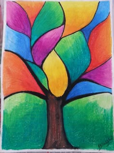 a drawing of a tree with colorful leaves on the top and bottom part of it