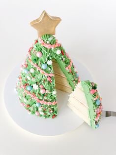 a christmas tree shaped cake on a white plate