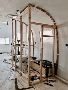 the inside of a building being constructed with wood