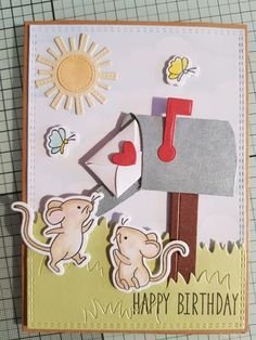 a close up of a birthday card with a mouse and mailbox on the front