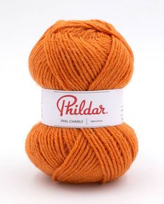 an orange ball of yarn with the word philar on it in red and white