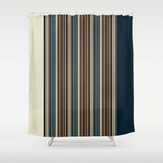 a striped shower curtain with blue, brown and white stripes on it's sides