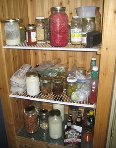 an open refrigerator filled with lots of food and condiments on top of shelves