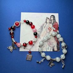 a bracelet with charms on it next to an image of a woman holding a cross