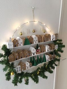 a shelf filled with lots of christmas decorations and lights on top of it's shelves