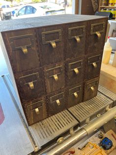 a large metal filing cabinet sitting on top of a table