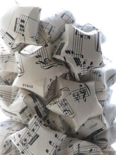 a pile of sheet music notes sitting on top of each other