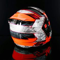 a helmet is shown on a reflective surface