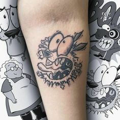 a tattoo on the leg of a person with many cartoon characters around it, including an angry bird