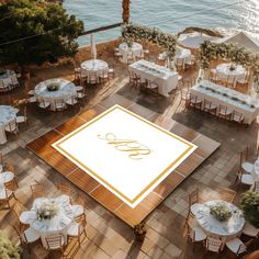 an aerial view of a wedding reception with tables and chairs