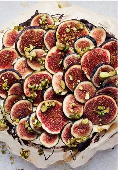 figs and pistachio on top of a cake