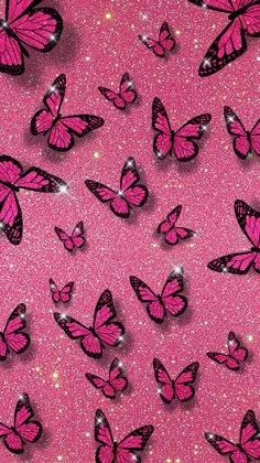 many pink butterflies flying in the air on a bright pink background with glitter flecks