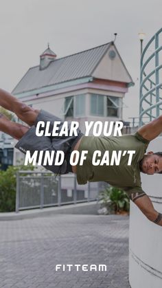 a man doing a hand stand in front of a building with the words clear your mind of can't