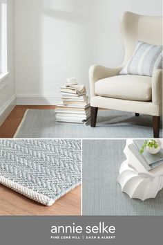 an image of a living room setting with white furniture and blue rugs on the floor