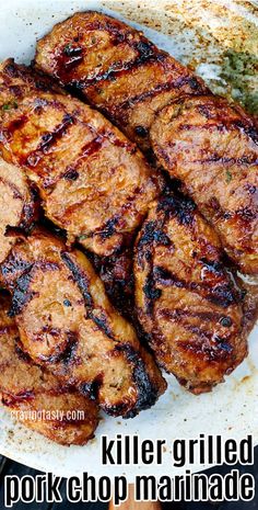 grilled pork chops on a white plate with the words killer grilled pork chop marinade