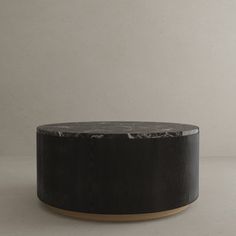 a black and white table sitting on top of a floor